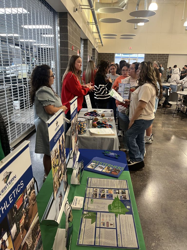 Students visit Western Texas College program tables in campus commons.