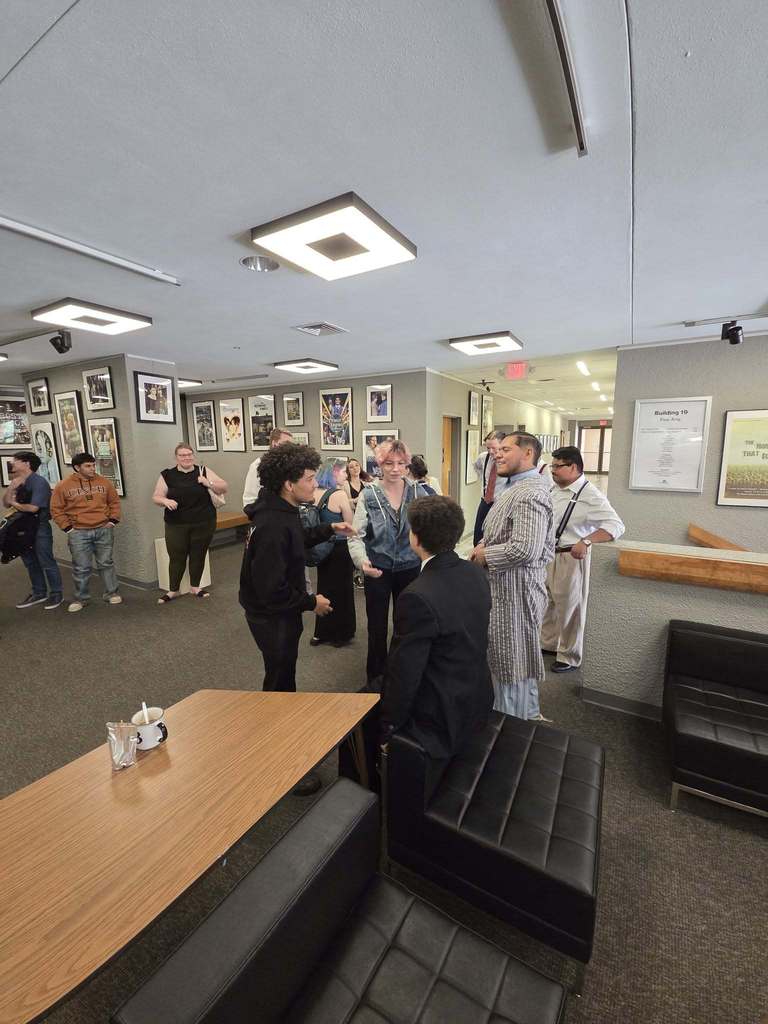 Students and guests gathering in the hallway