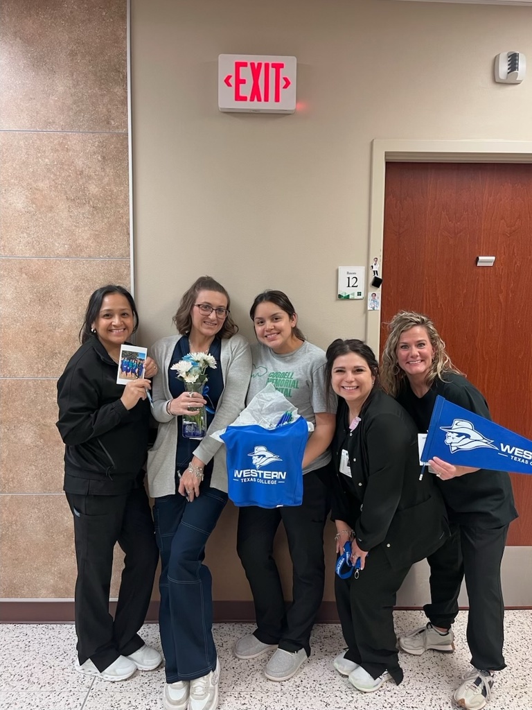 Cogdell Family Clinic employees hold a goodie basket from left to right: Daisey Bailey, Whitney Sterling, Emily Sosa, Kaley Stansell, and Tiffany Rinehart.