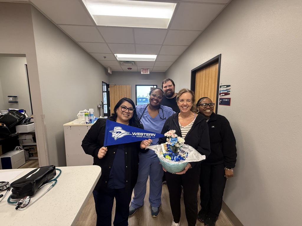 My Urgent Care - Abilene Location employees hold a goodie basket. Left to right: Carrie, MA: Tanesha, FNP; Stephen, FNP; Kelly, FNP; and Asya, MA.