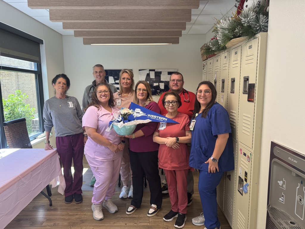 Fisher County Clinic employees hold a goodie basket: Crystal Coker, LVN; Dr. Chad White; Virginia Arce, LVN; Amanda Bell, LVN; Angela Messick, Clinic Manager; Virginia Perez, MA; Kevin Kelly, APRN; and Sandra Messick, Registered MA.