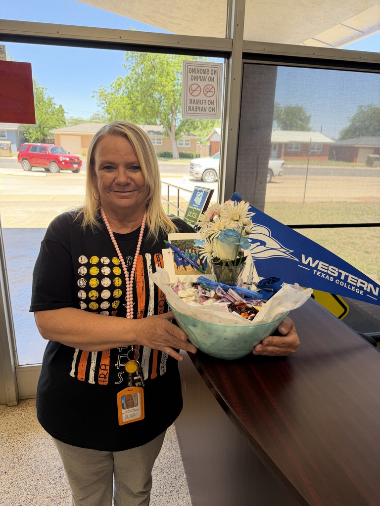 Laurie Walker from JETS holds a goodie basket.