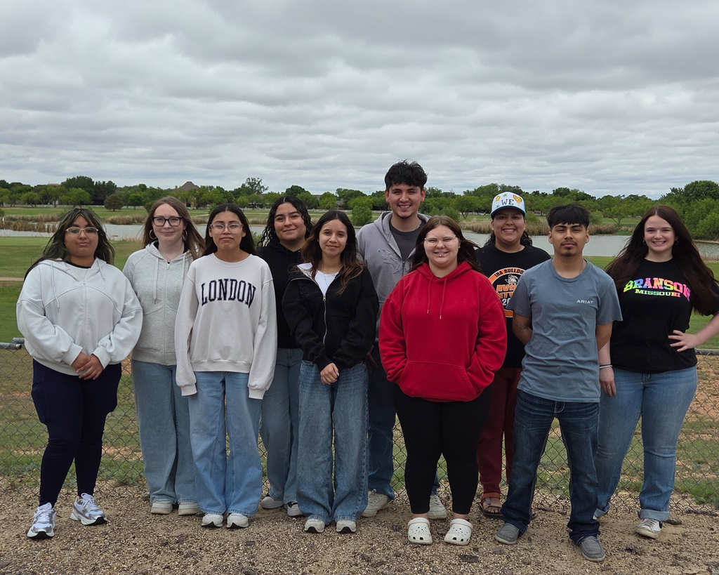 2025-2026 Opportunity Waiver Students pose as a group by the Golf Course.