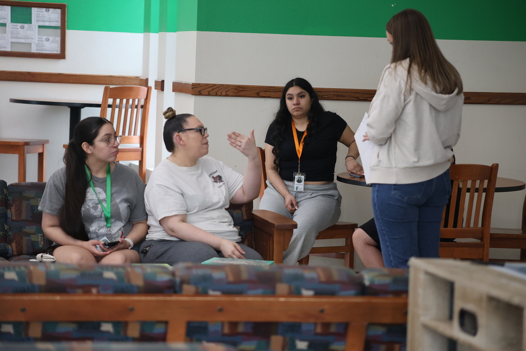 Upward Bound staff meet with new residents inside residence hall lobby during WTC housing move-in and orientation activities.