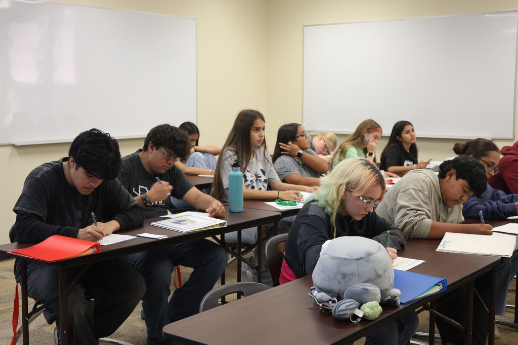 Students complete written assignments during a classroom session at Western Texas College.