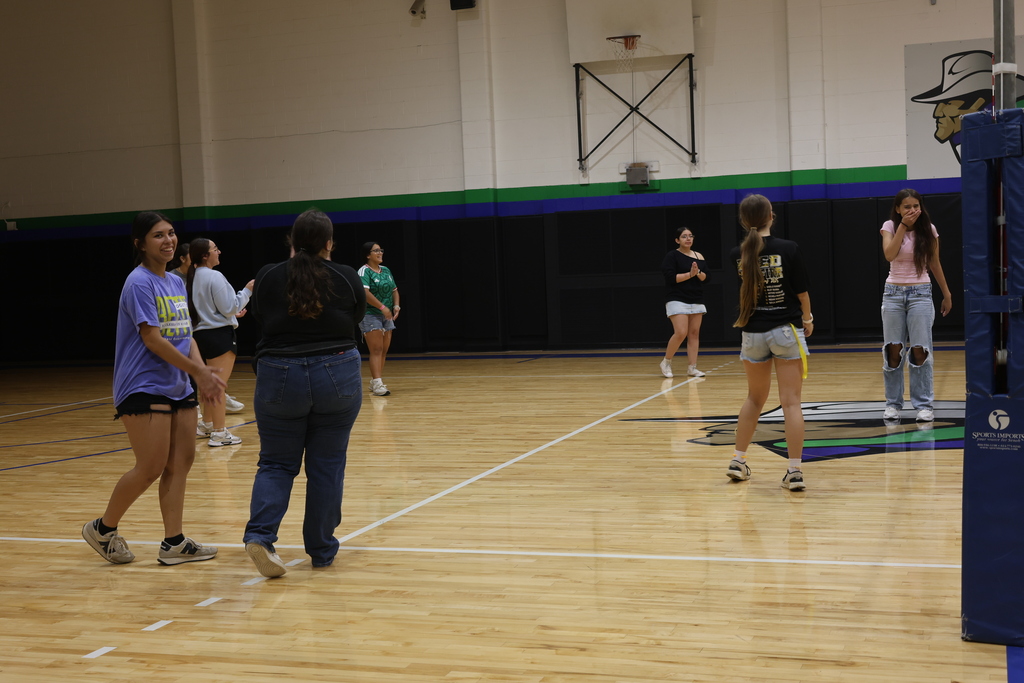 Students laugh and socialize while participating in a volleyball activity at WTC.