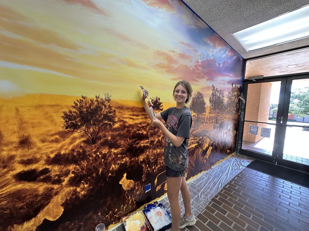 Lexi Antonick works on the new mural in the Western Texas College Resource Center.