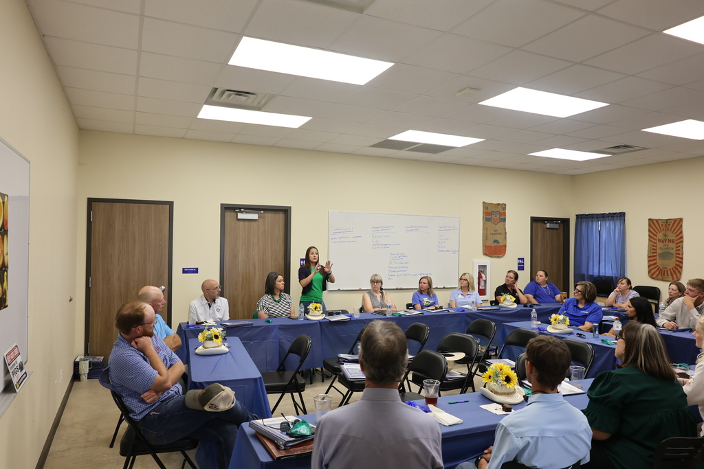 A Western Texas College representative leads a group discussion inside the Agricultural & Rodeo Complex classroom.