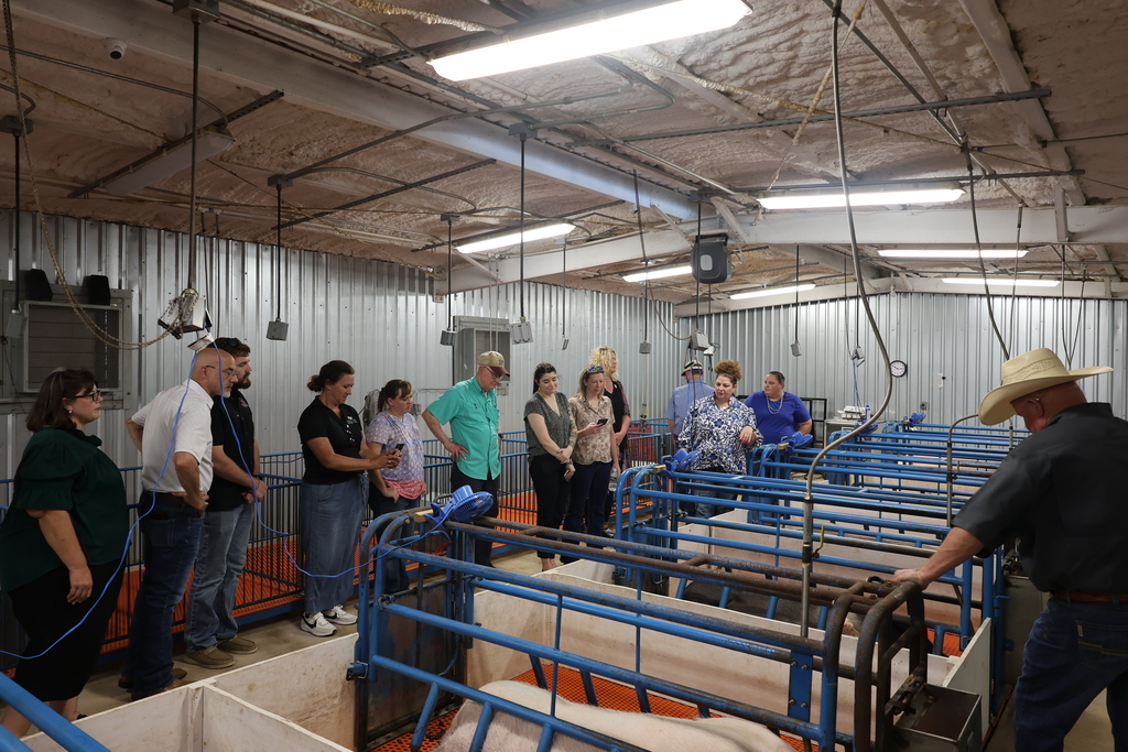 Visitors tour the swine facilities at the Western Texas College Agricultural & Rodeo Complex.