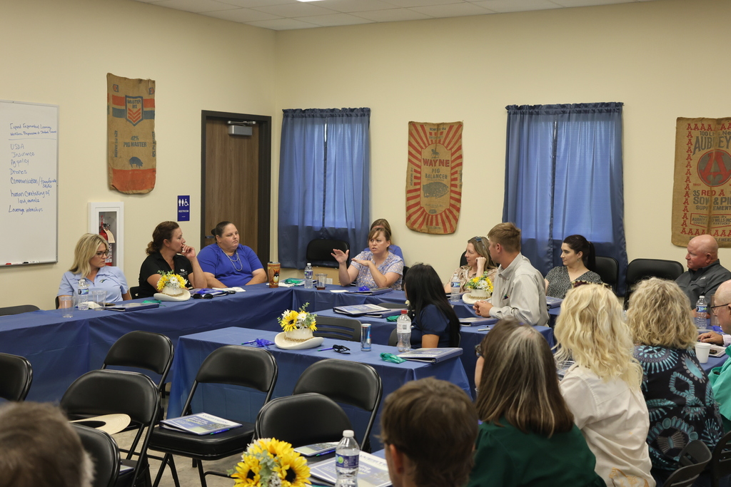 Visitors discuss agriculture topics during a meeting at the Western Texas College Agricultural & Rodeo Complex.