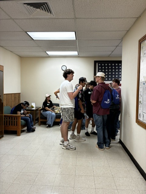 New students gather outside a campus office during Western Texas College New Student Orientation.