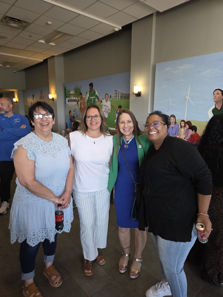 Four Western Texas College employees smile together during the Welcome Back Brunch