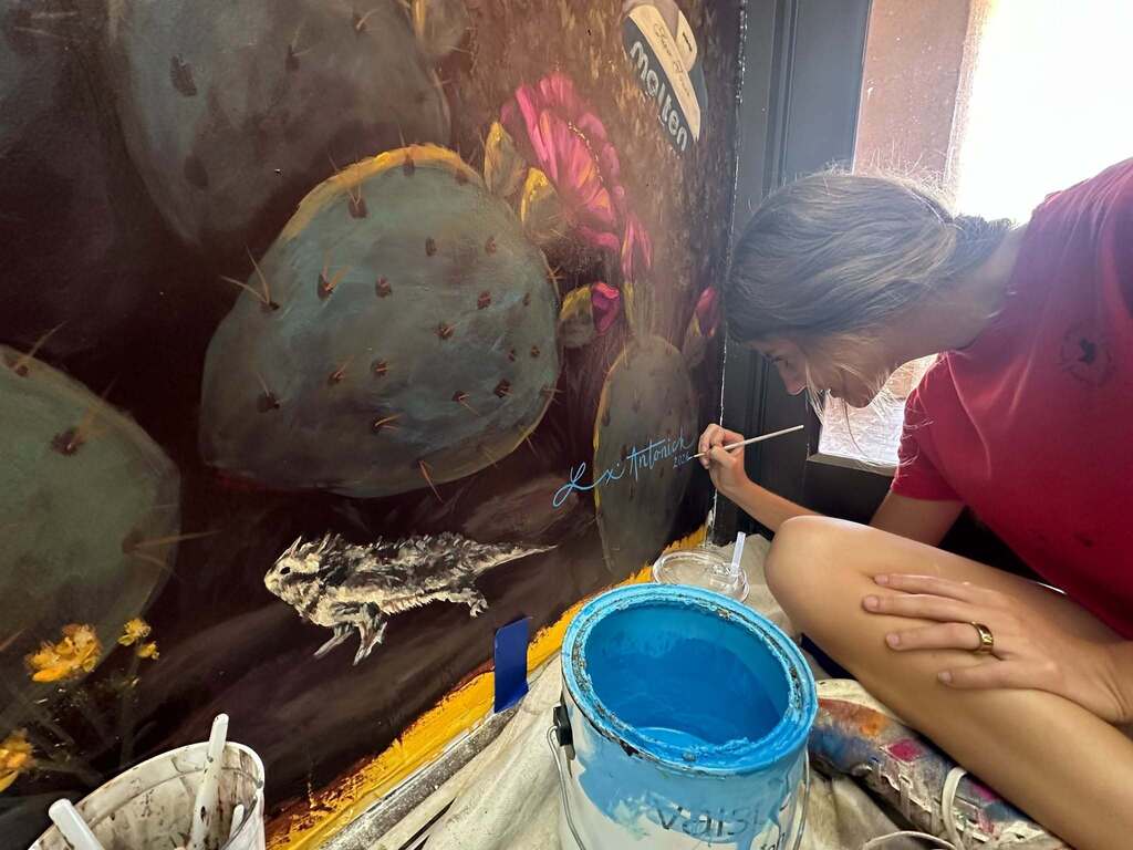 Lexi completing mural