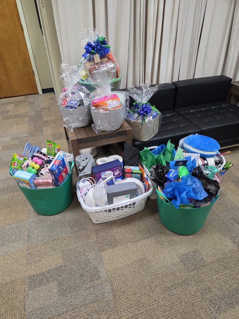 Several baskets filled with dorm essentials and supplies are arranged together for WTC students.