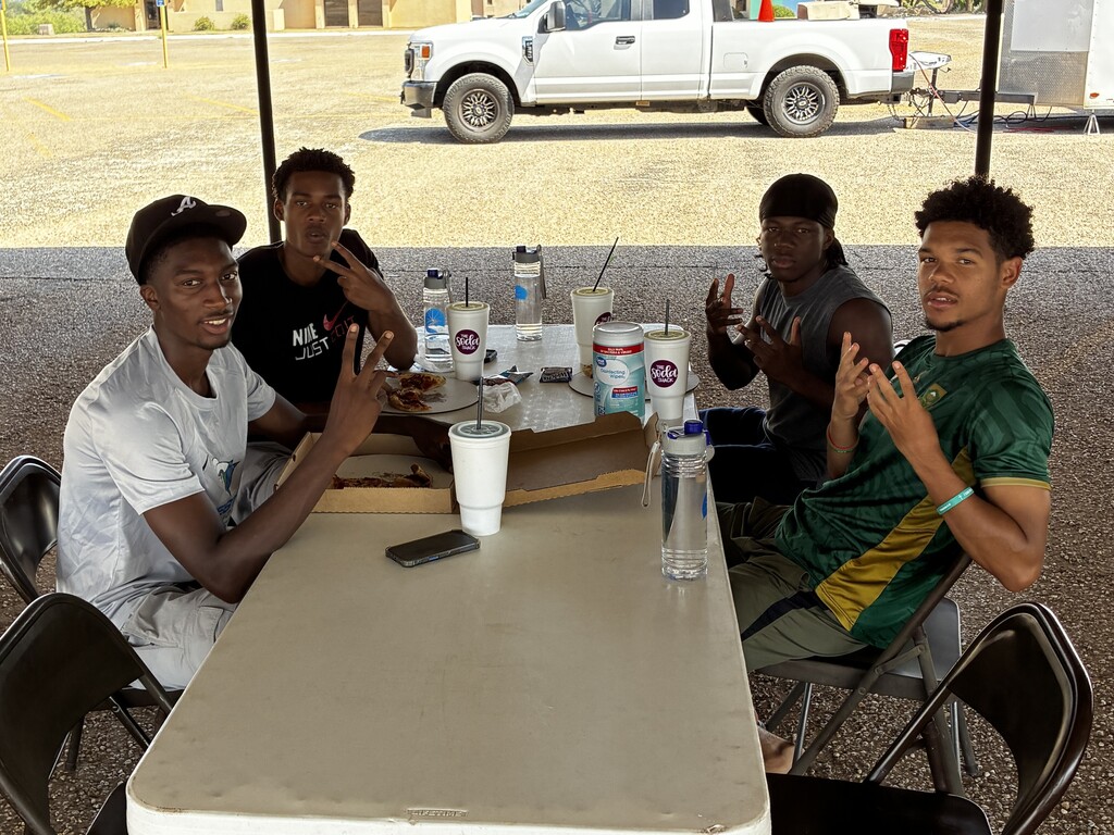 WTC students eat together at an outdoor table during Westerner Welcome Day.