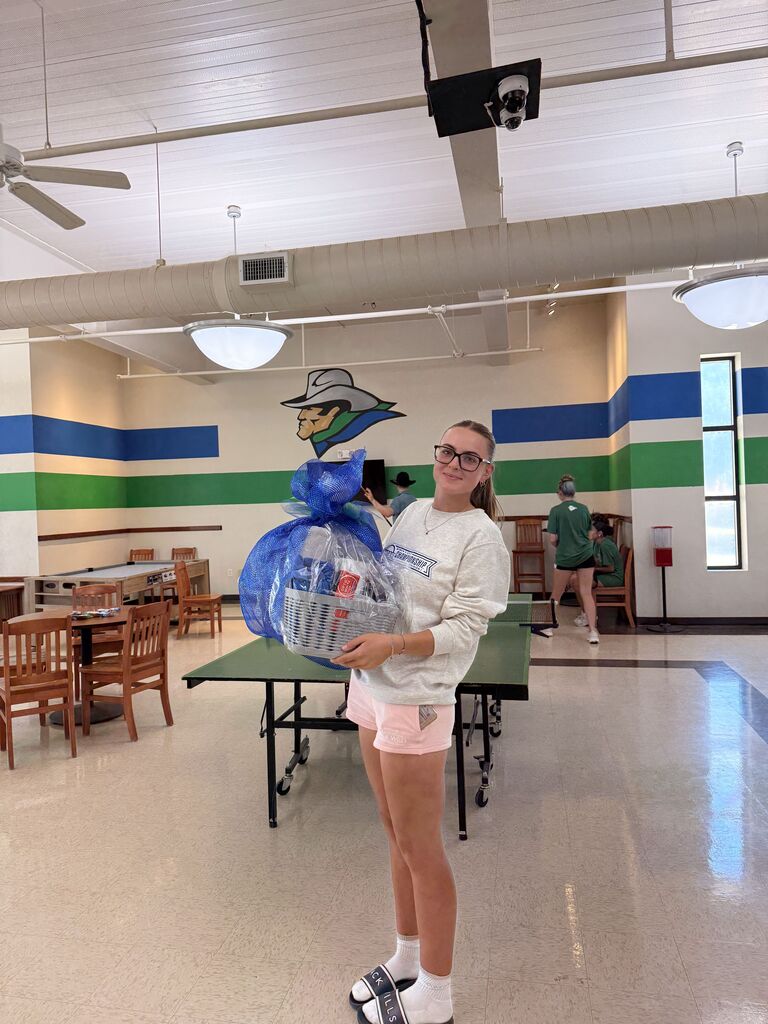 A WTC student holds a prize basket inside the Student Commons during Westerner Welcome Day.