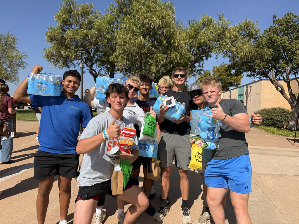 WTC students pose with cases of water and prizes during Westerner Welcome Day.