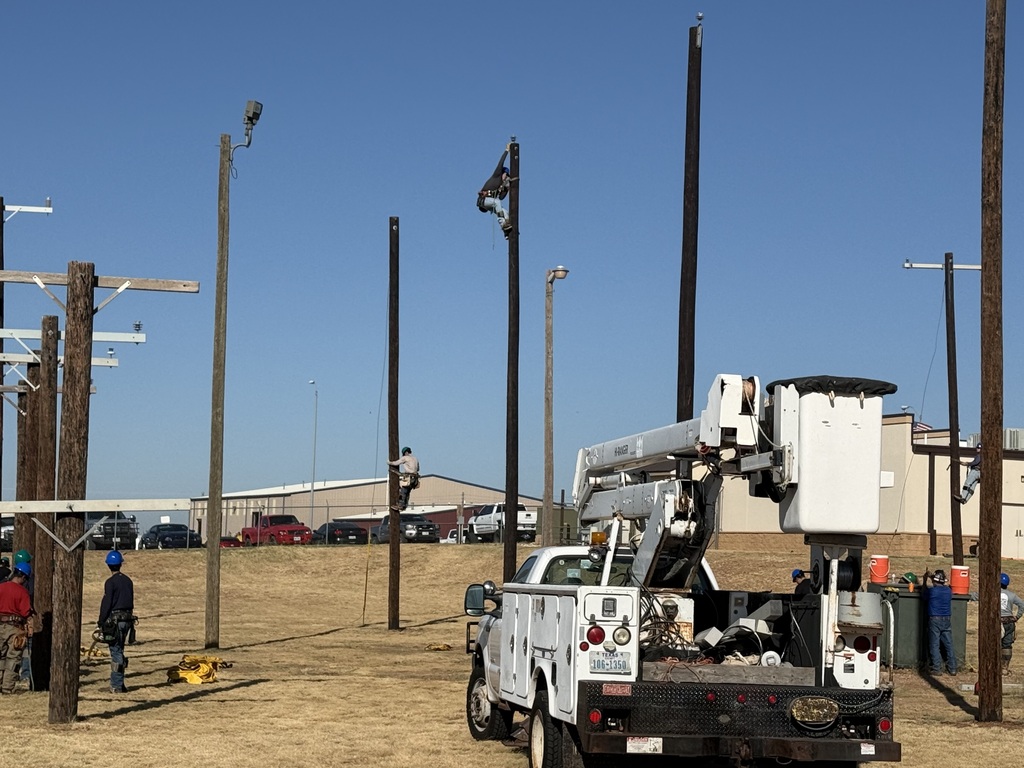Electrical Lineworker Technology students practice climbing utility poles at WTC’s outdoor training yard.