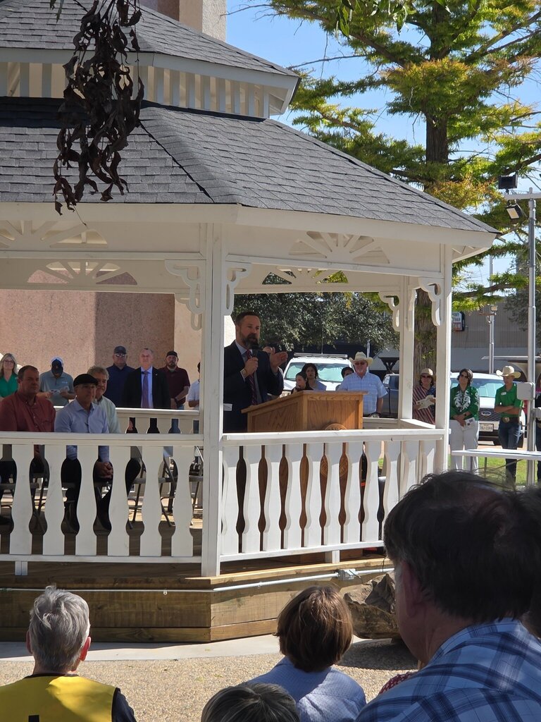 A speaker addresses attendees from a gazebo during the Scurry County 150th anniversary celebration.