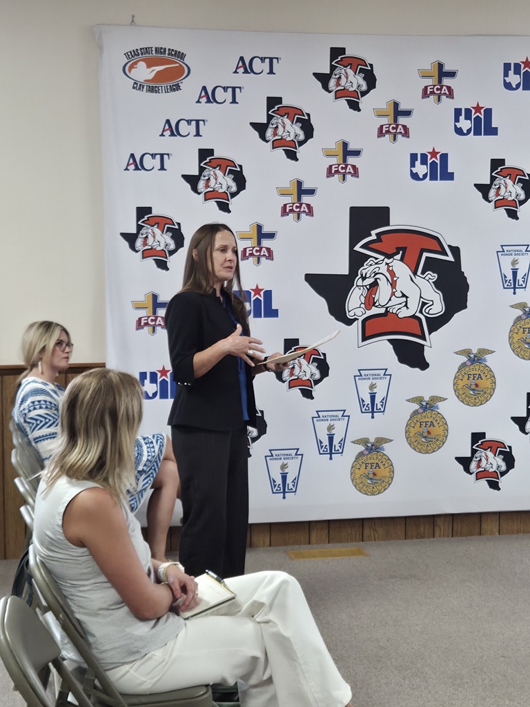 Dr. Laurie Sharp speaks to attendees during an Ira ISD School Board meeting.