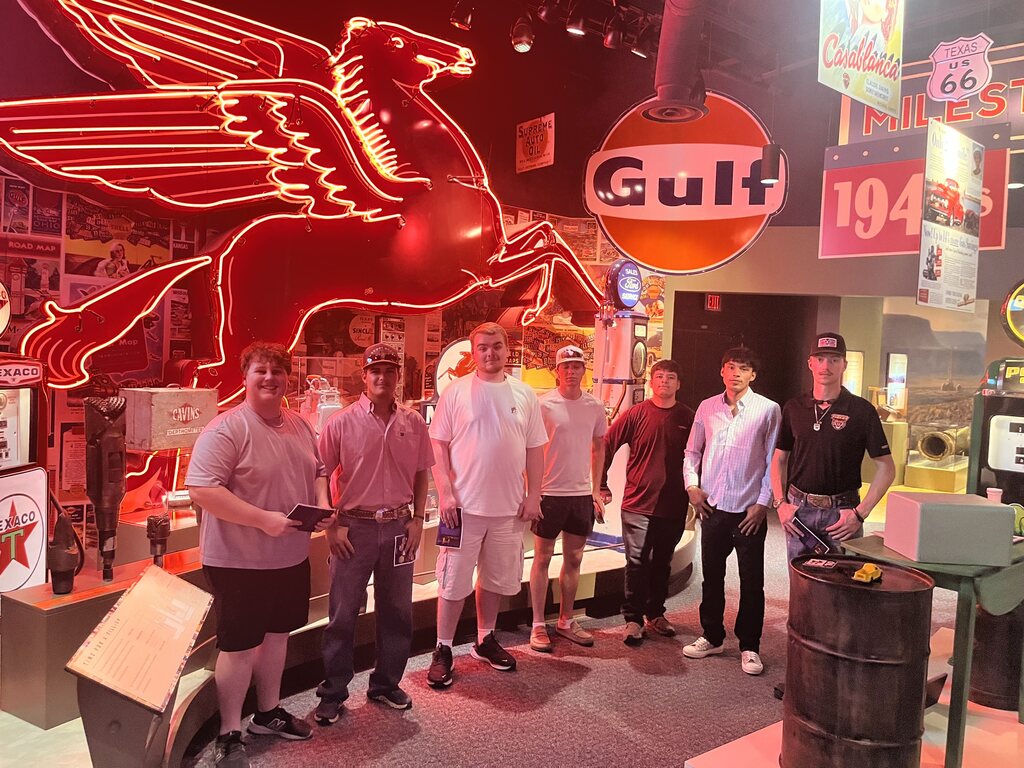 Western Texas College students pose for photo in the sign room at the Petroleum Museum.