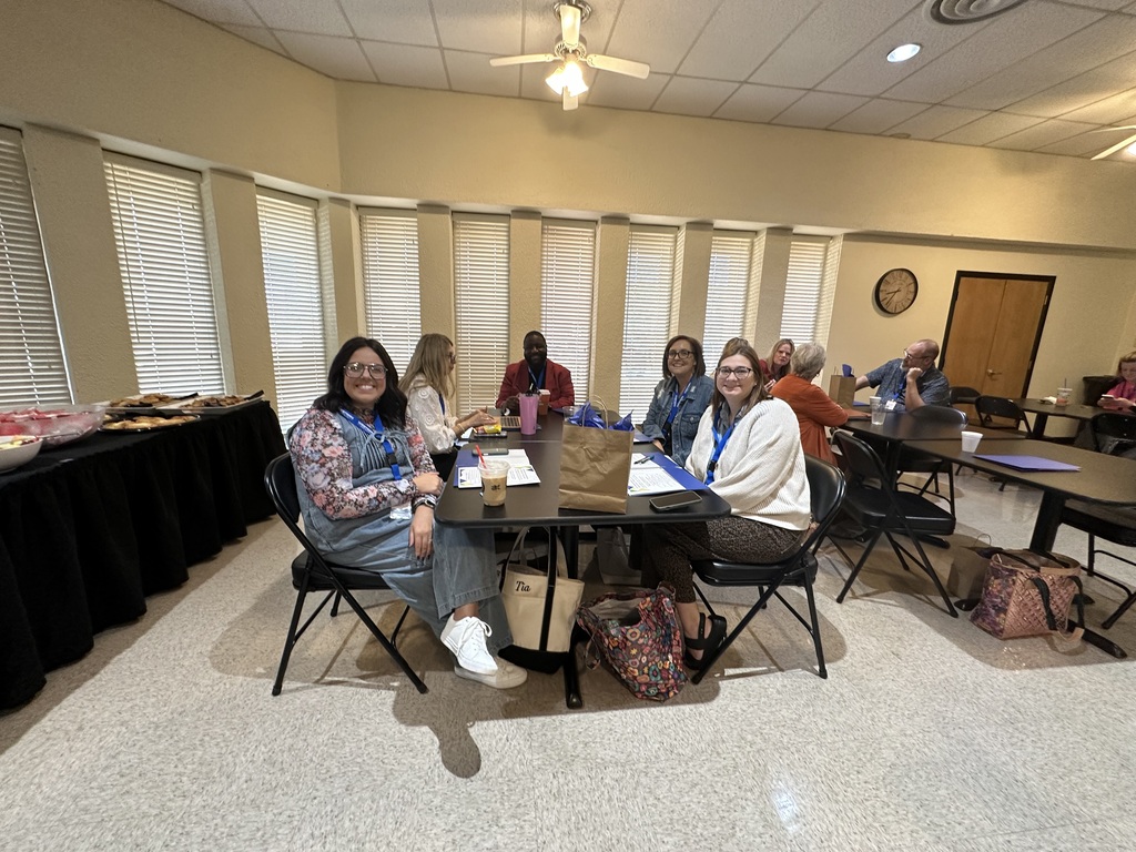 Area school district employees smile together during the 2026 Annual Education Partnership Summit.