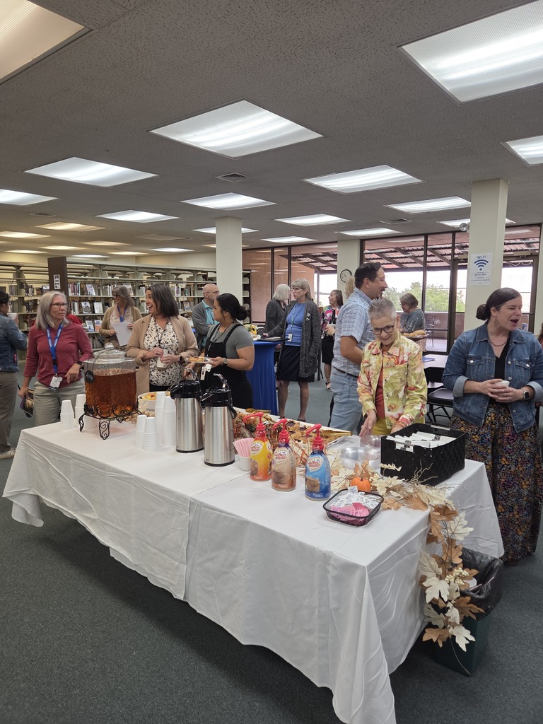 WTC employees and community members visit over coffee and refreshments during Coffee with the Chamber.