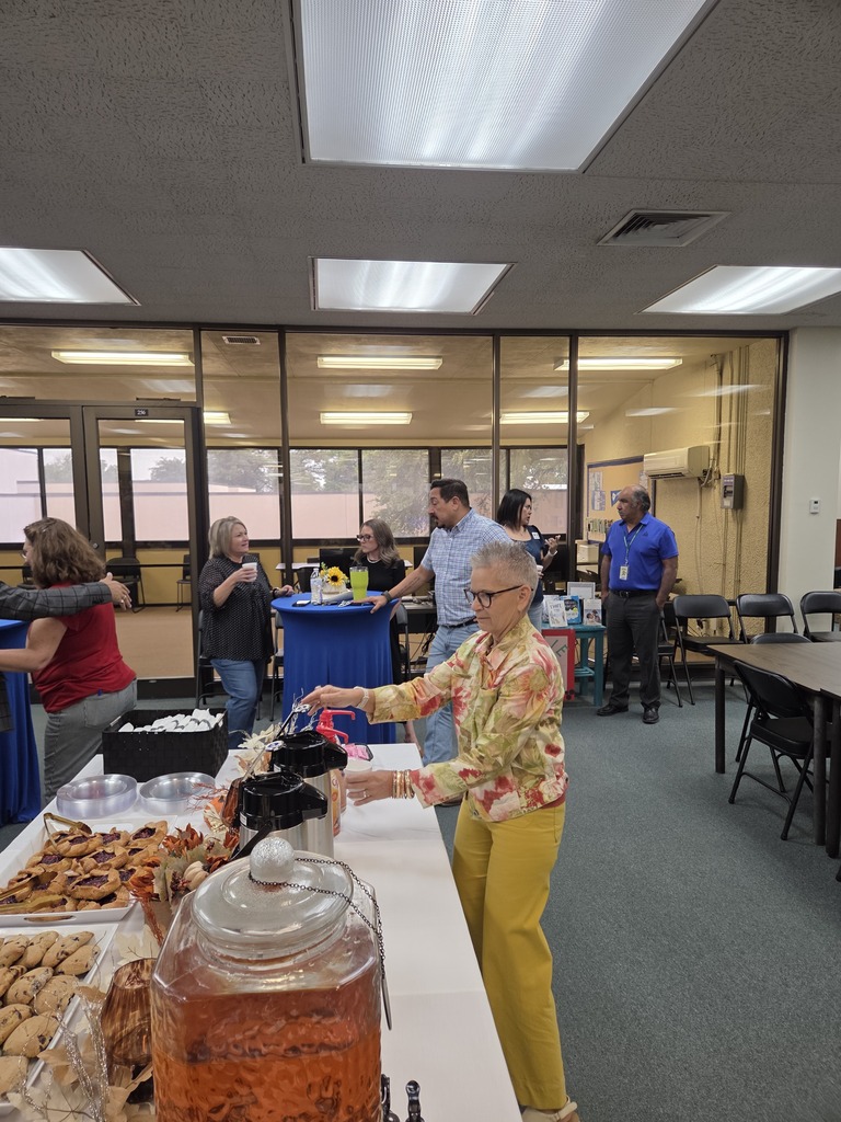 WTC employees and guests gather around refreshments during Coffee with the Chamber in the Resource Center.