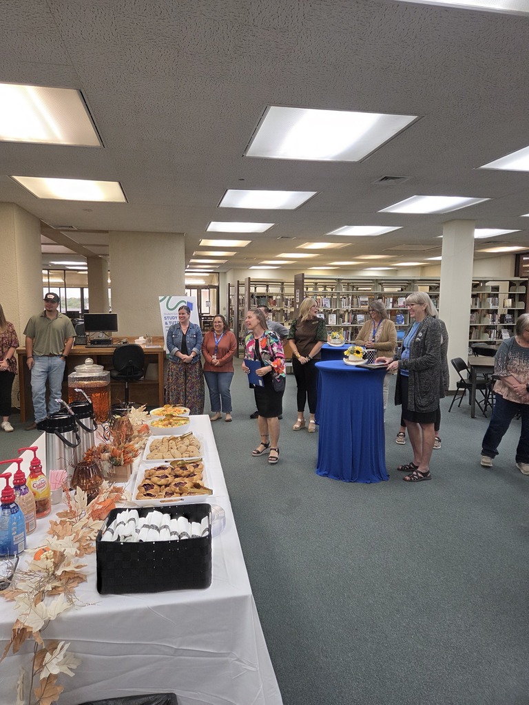 Dr. Sharp speaks to guests at the Coffee with the Chamber event in the Resource Center.