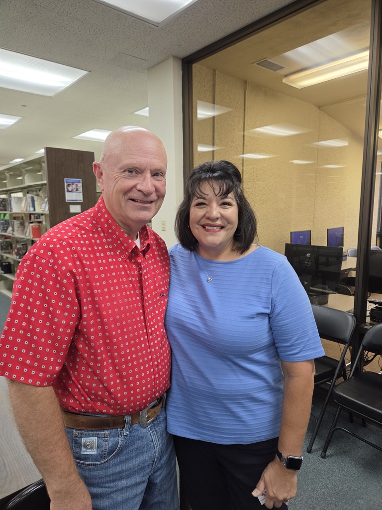 Two attendees smile together during Coffee with the Chamber at Western Texas College.