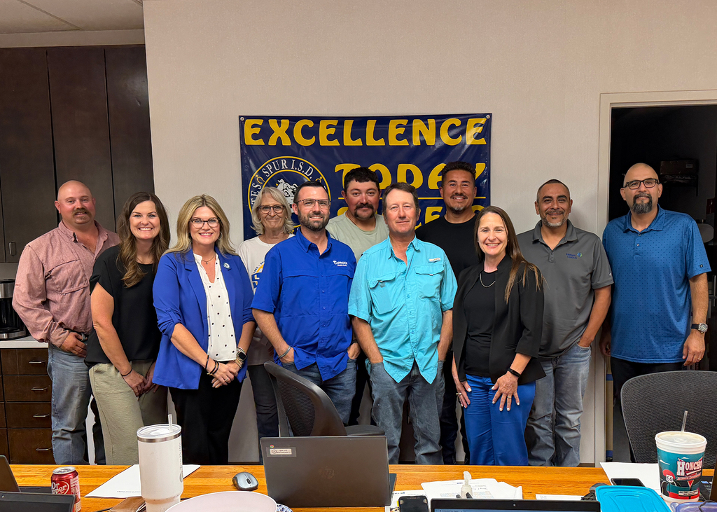 WTC President Dr. Laurie Sharp (in black on the right ) and WTC Director of Dual Credit and Course Sharing Molli Fleming (on the left in the blue jacket) with the Spur ISD Board of Trustees at their board meeting on September 28.