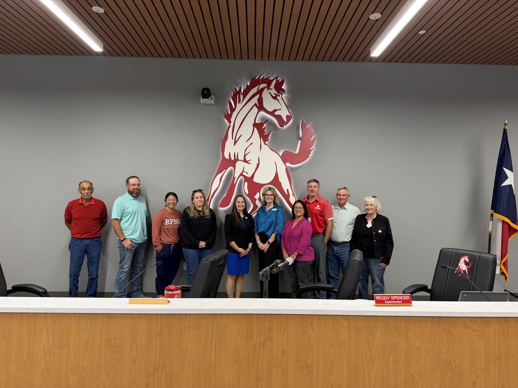 WTC President Dr. Laurie Sharp (center, in black) with WTC Dual Credit and Course Sharing Director Molli Fleming (center, in blue) and the Sweetwater ISD Board of Trustees.