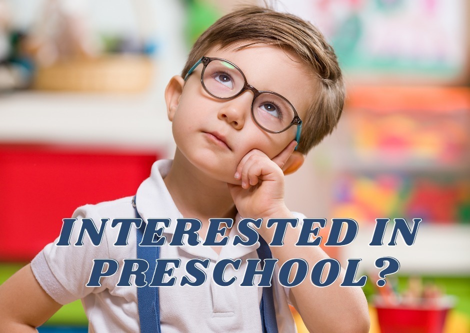 Boy thinking with hand on chin