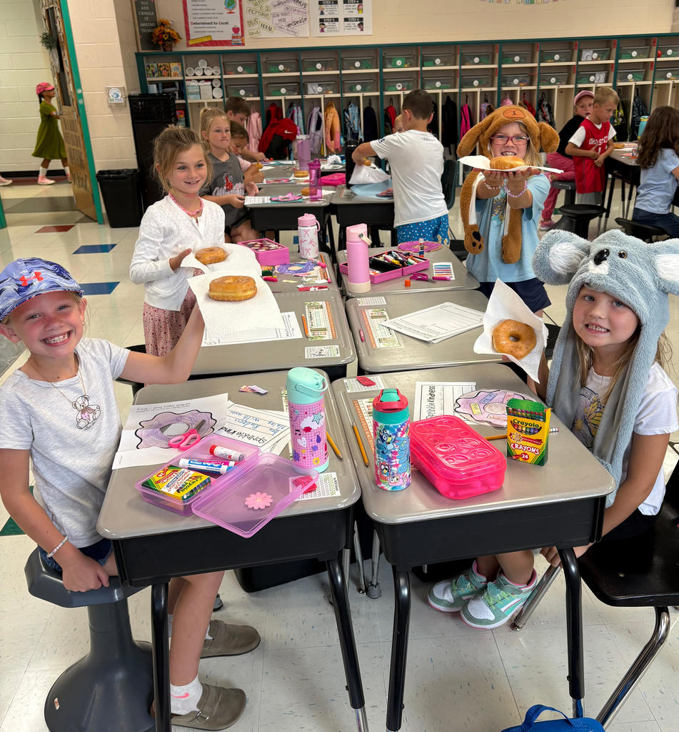 Students enjoying donuts