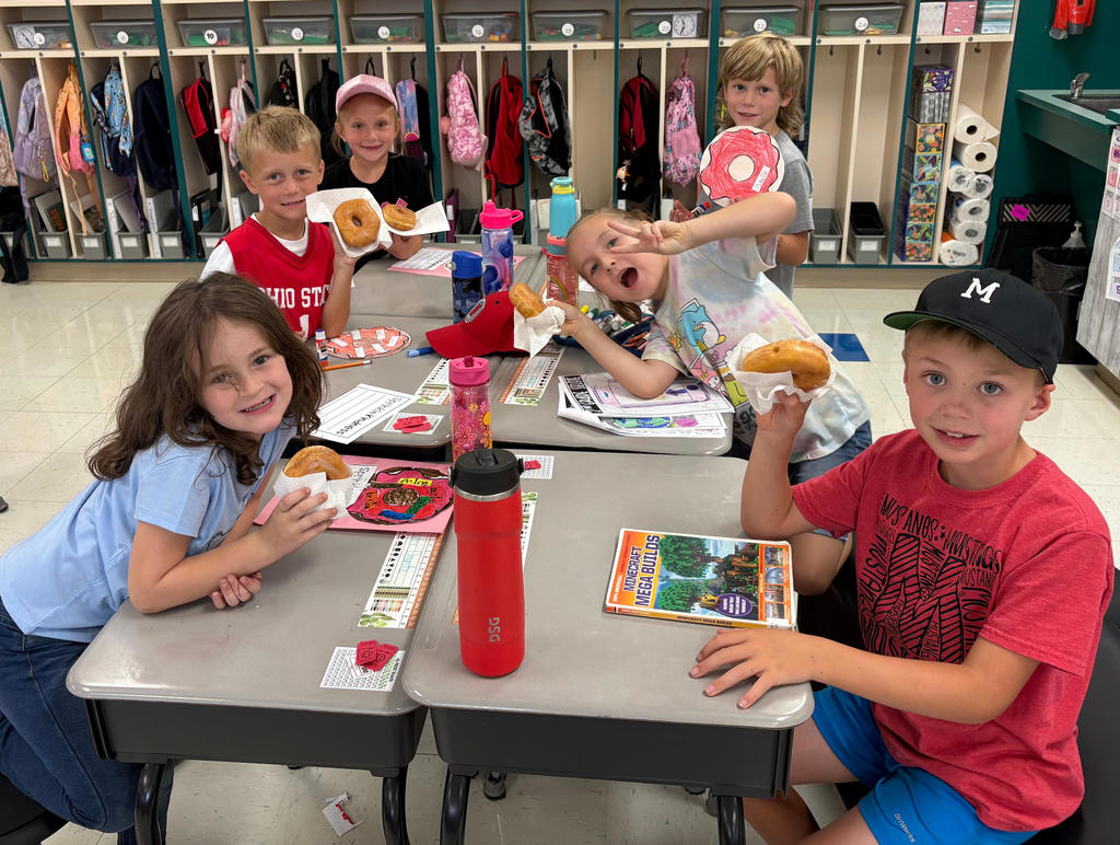 Students enjoying donuts