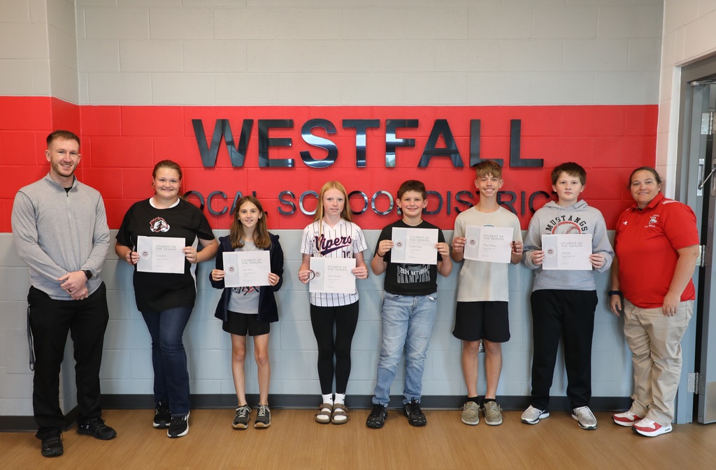 Students of the Month posing with certificates