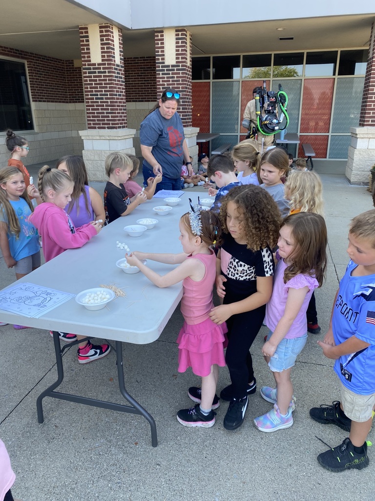 Students working on a project at an outdoor table