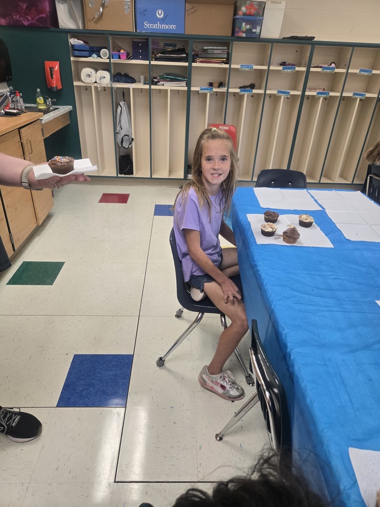 Student with cupcakes