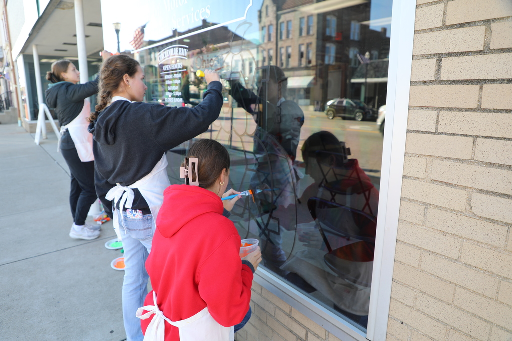 Students painting window