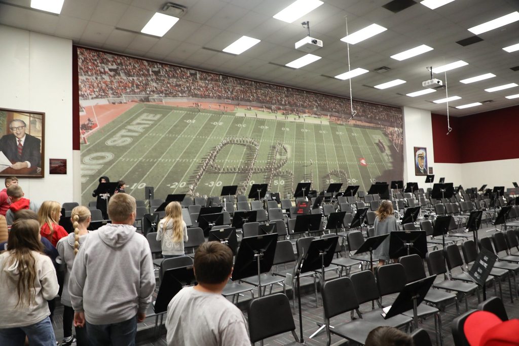 Students exploring band room