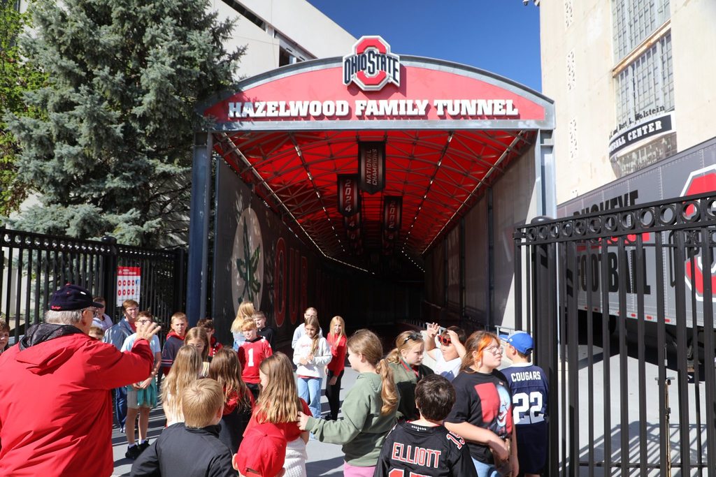 Students at football stadium tunnel