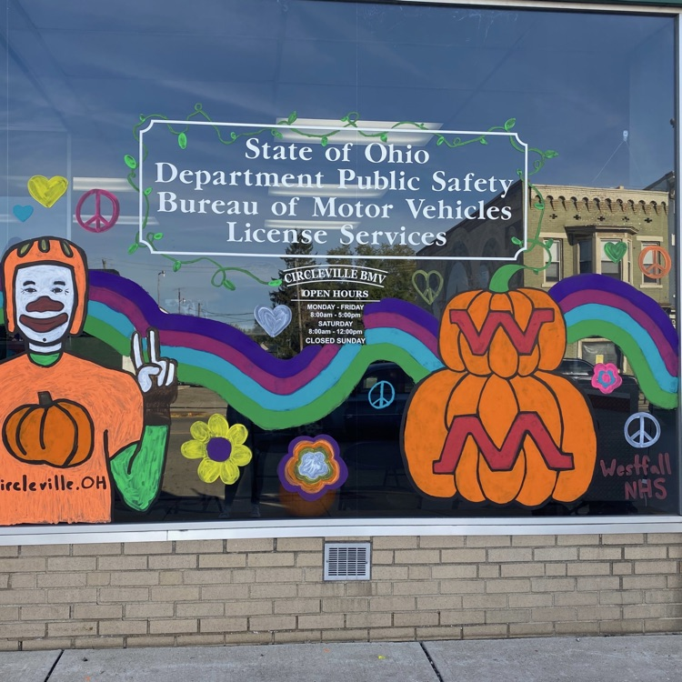 painted window with pumpkins and pumpkin man