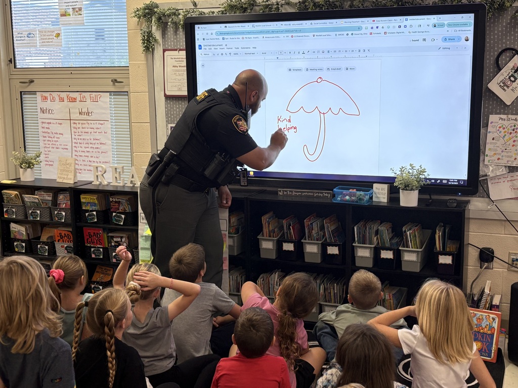 Deputy Freeman drawing on the smartboard