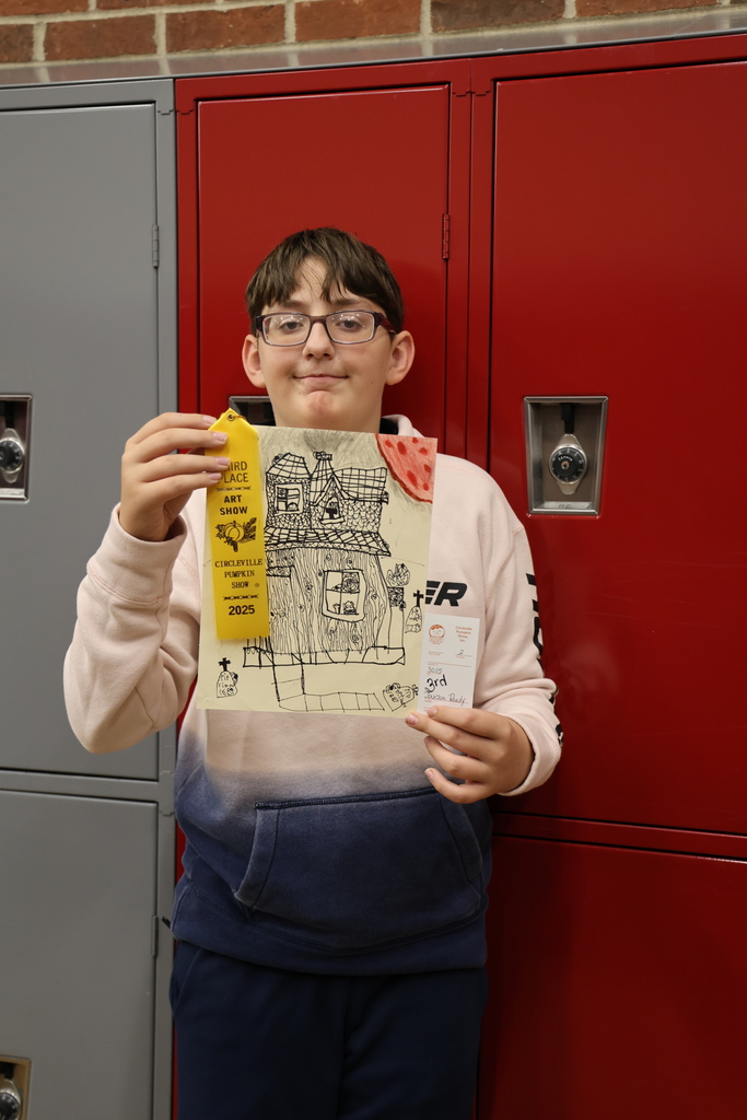 Photo of Jaxson Reedy with artwork
