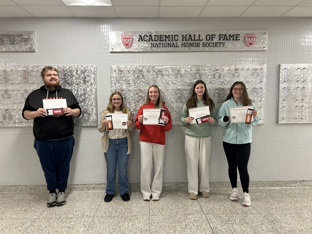 Students of the Month posing with certificates