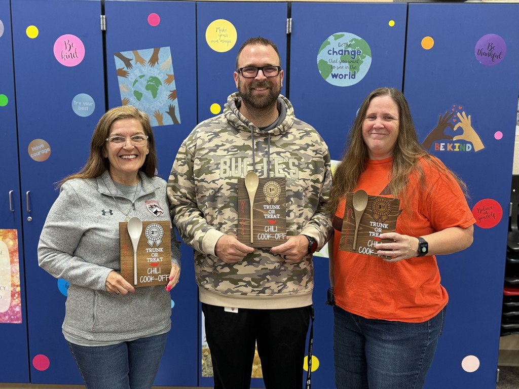Chili Cookoff Winners holding award plaques