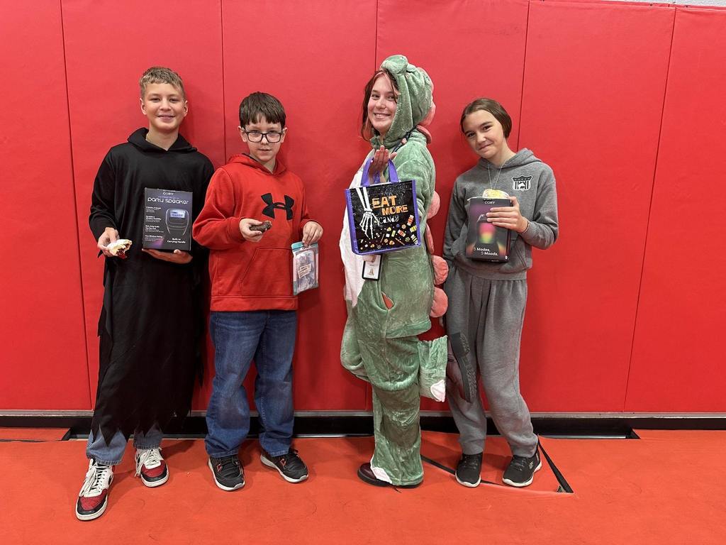 students holding treat bags