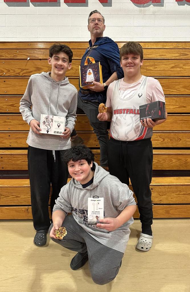 students and teachers holding treat bags