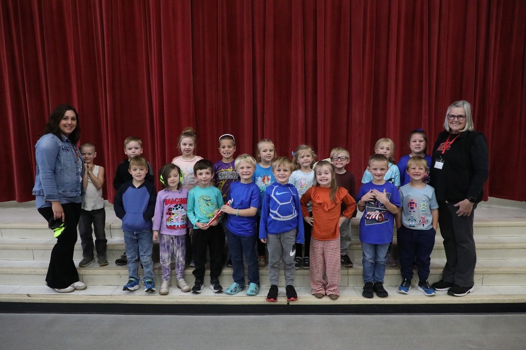 Mrs Schrader's class holding the spirit stick