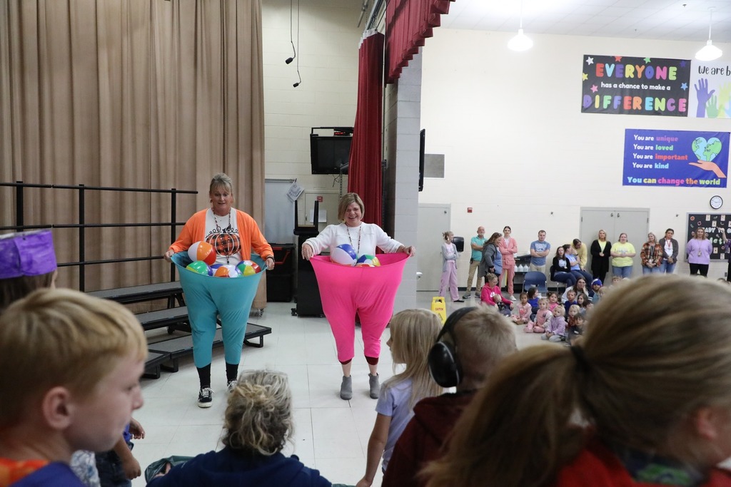 Mrs Wolfe and Mrs Patterson in hooped pants filled with inflatable beach balls